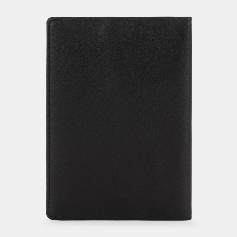 The SLNT RFID Passport Wallet by SLNT is displayed closed, standing upright against a plain white background.