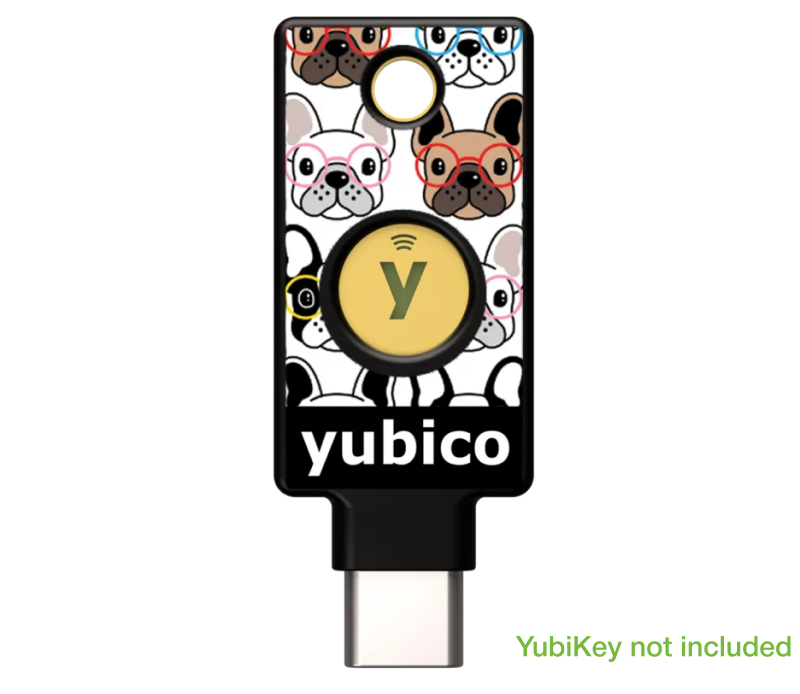 YubiStyle Cover (YubiDogs) by Yubico features cartoon French bulldogs with colorful glasses. "yubico" is printed at the bottom. Text in the corner reads, "YubiKey not included." Perfect for fun customization!.