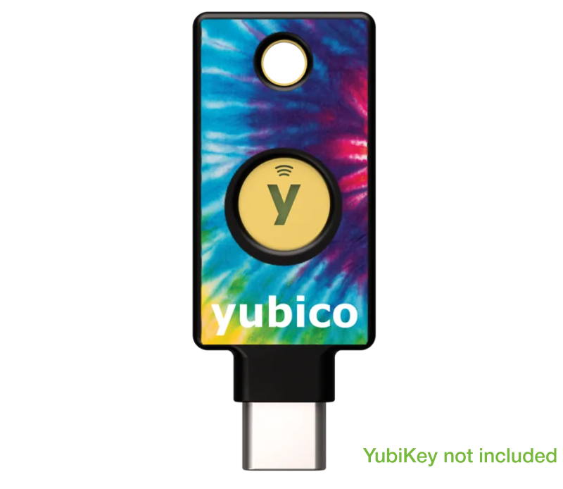 The YubiStyle Cover (Tie Dye) by Yubico features a vibrant tie-dye design, a central round yellow button, "yubico" at the bottom, and “YubiKey not included” in green at the lower right. Perfect for pairing with YubiStyle stickers.